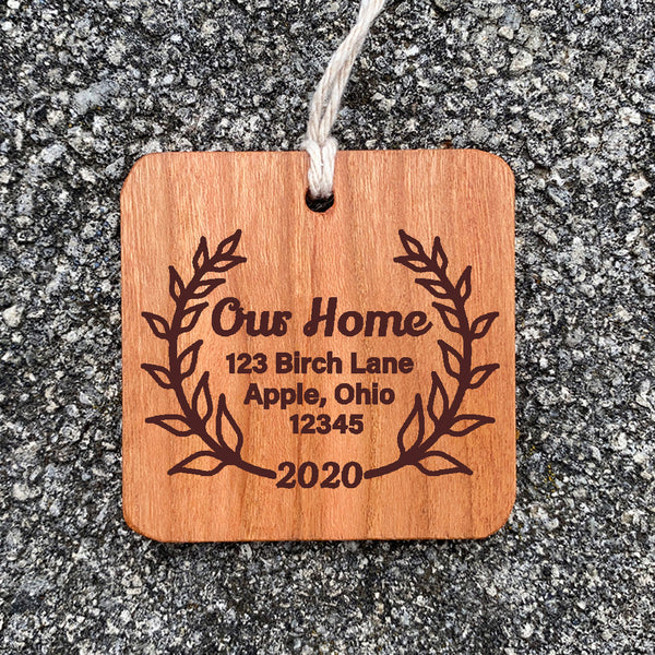 Wood Ornament laser engraved text My New Home with address enclosed in leaves.
