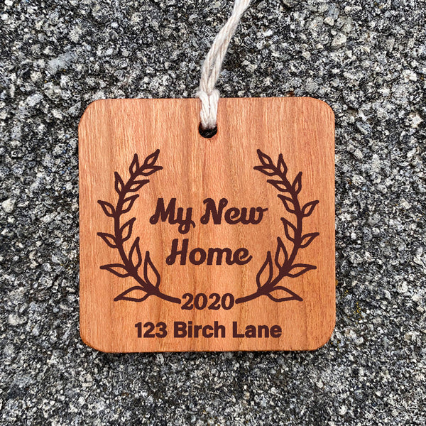 Wood Ornament laser engraved text My New Home with street address enclosed in leaves.