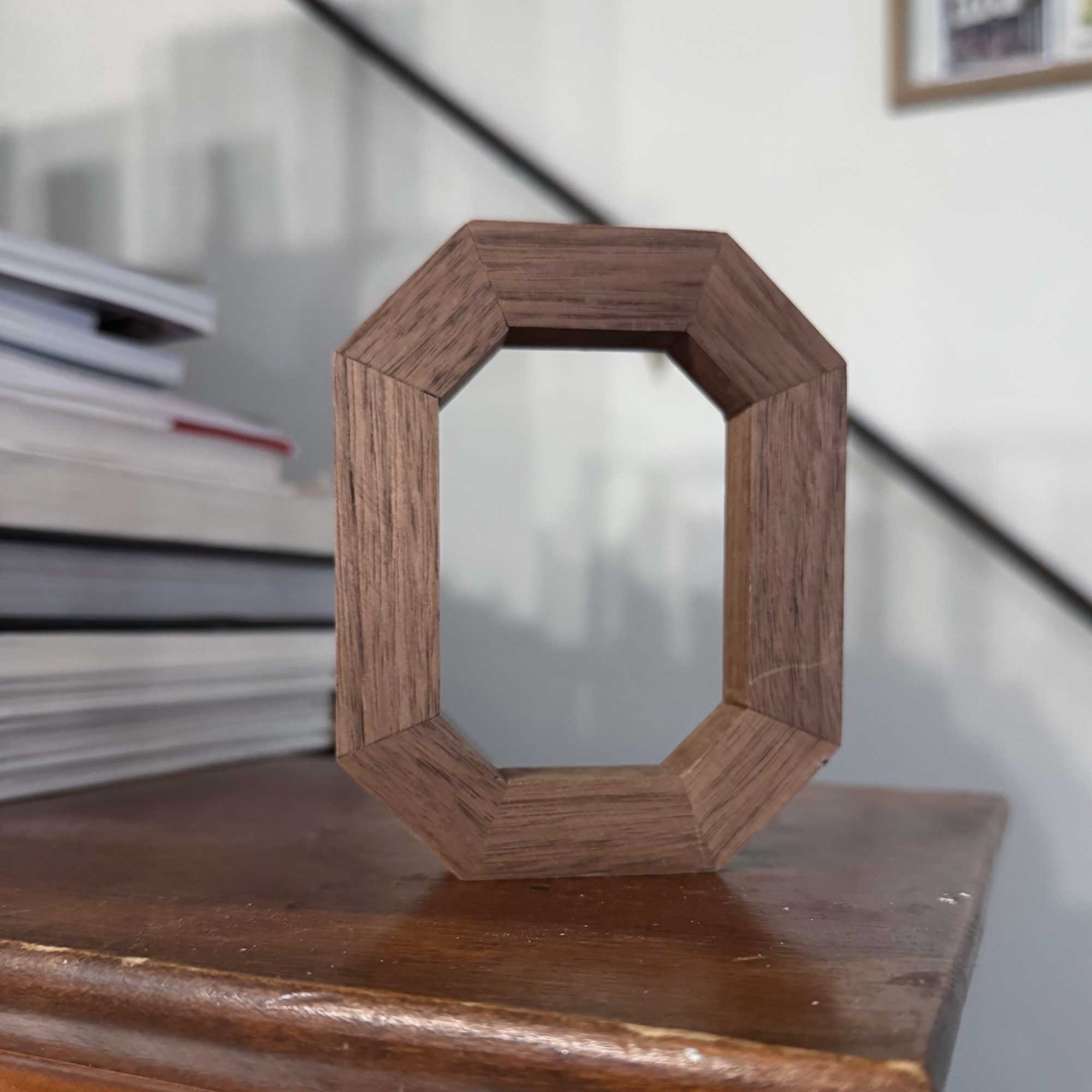 Solid Walnut Block O on wood mantel