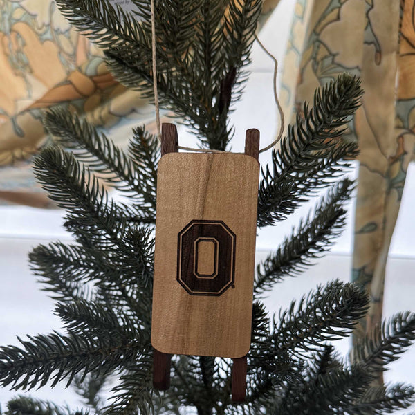 Wooden ornament with OSU Block O on a Christmas tree