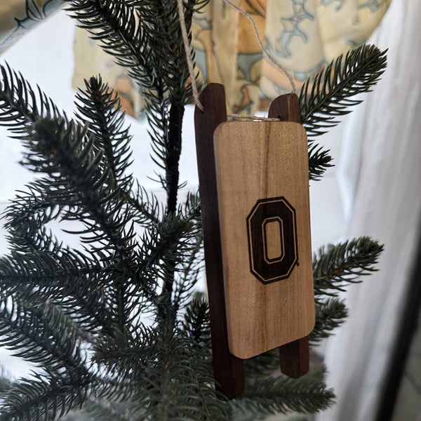 Wooden ornament with OSU Block O on a Christmas tree