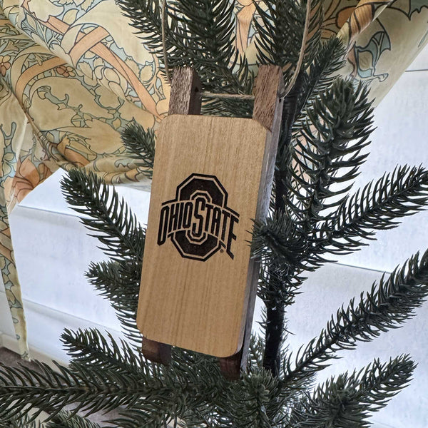 Wooden Sled Ornament with OSU Block O Laser engraved on a Christmas Tree from the side
