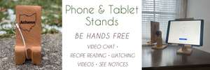Banner with text and two photos showing handmade wood tablet stands. Wood Phone and Tablet stands by Fallen Tree Woodshop. Be hands free for video chats, reading recipes,  watching videos and see notices..
