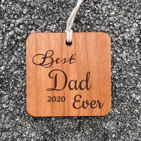 Best Dad Ever Ornament on a concrete background.