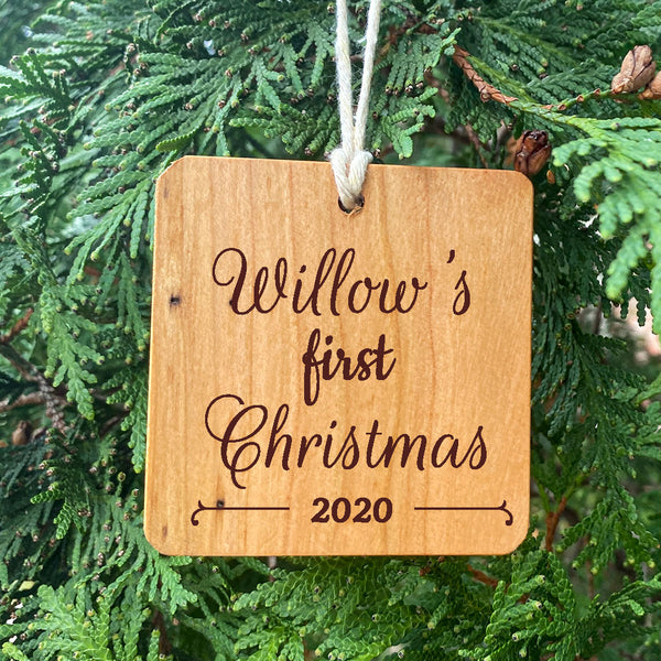 Customized Baby or Pet First Christmas Ornament on Pine Tree Background