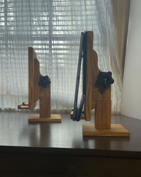 Two adjustable wood tablet stands show at a vertical angle. One shows an iPad on the tablet stand.